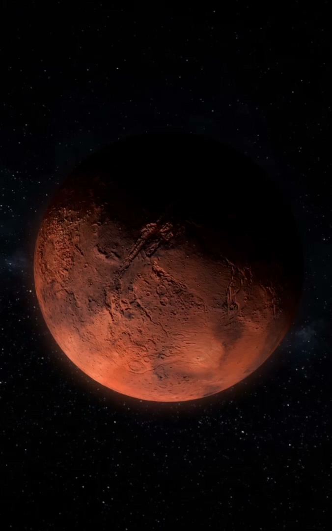 A red planet turning in a starfield, the visual for the app’s Focus mode.